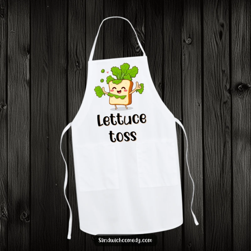 Funny apron showing a sandwich character with crusty arms enthusiastically juggling green lettuce leaves, ideal for kitchen fun.